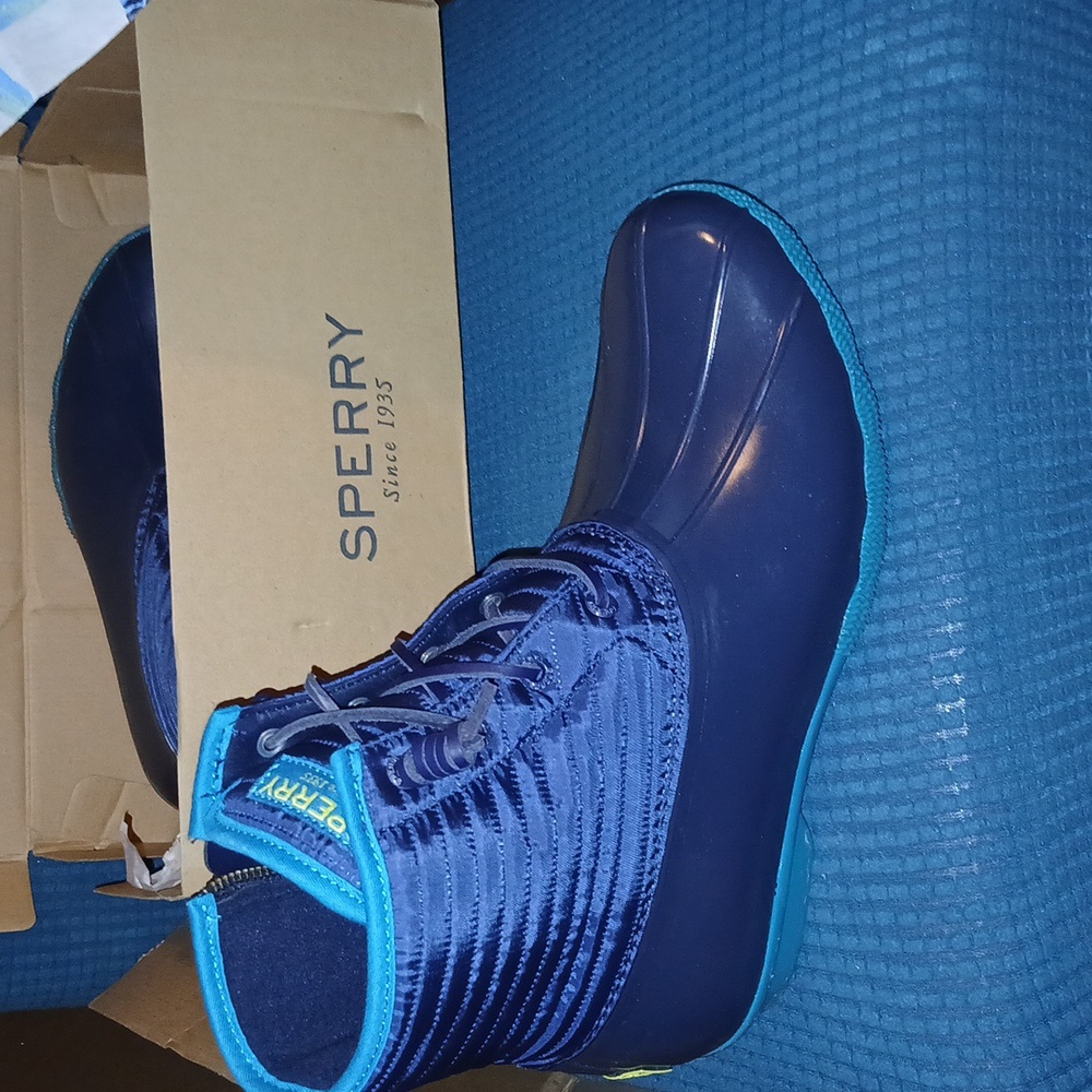 Multi colored blue leather  Sperry boots.